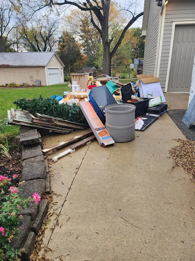 Dumpster being loaded with debris for Residential Dumpster Rental in Hatfield